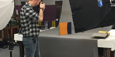 photographer taking picture of ring binder